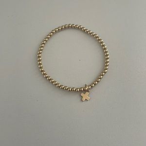 Gold enewton cross bracelet